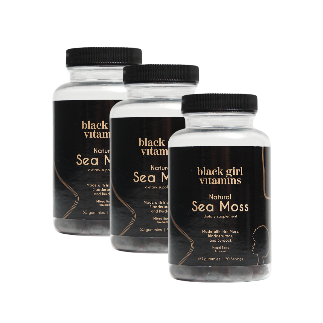 Three bottles of Black Girl Vitamins Natural Sea Moss gummies with Irish Moss, Bladderwrack, and Burdock, mixed berry flavor